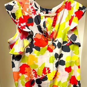 Sleeveless top with ruffles. Size Large.